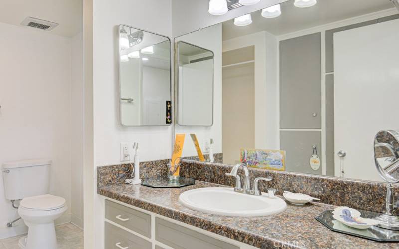 Pretty bathroom with newer sink and faucet.