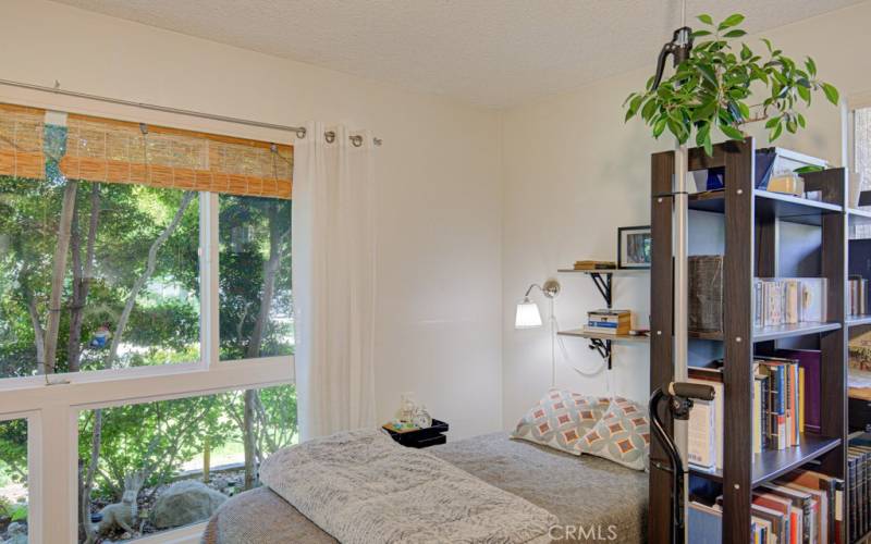 Here's another cozy sleeping area just behind the bookcase/room divider in the living room.