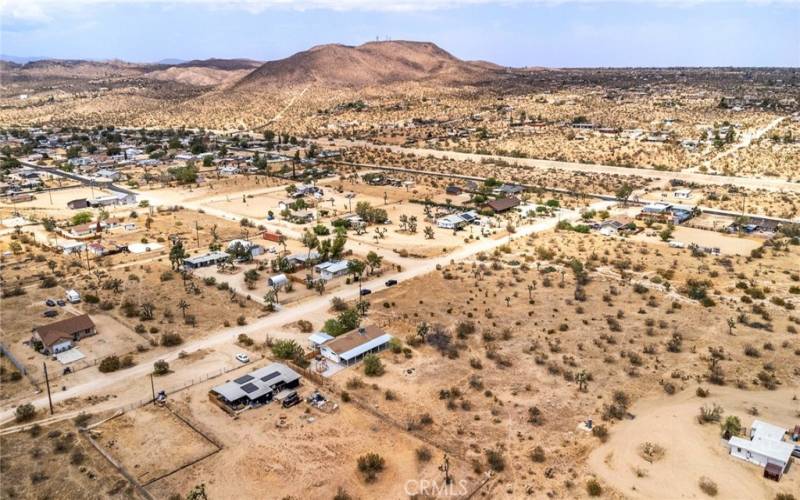 Arial view of side back of home from neighboring home.