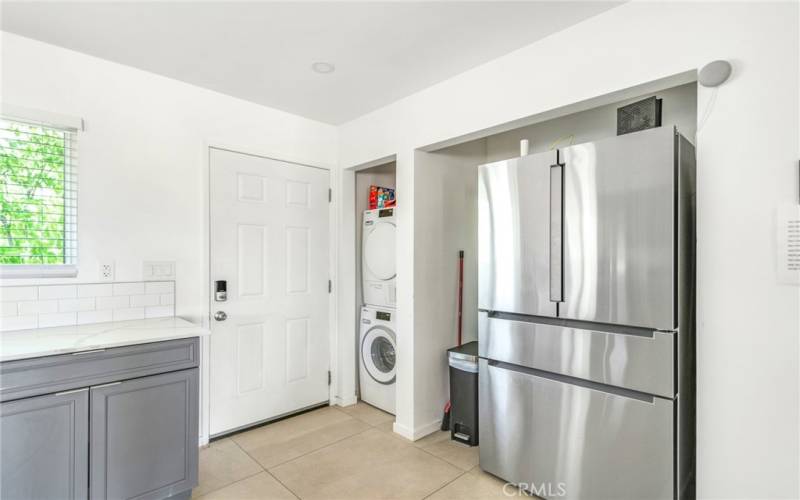 Main entry, including stackable washer, dryer and refrigerator