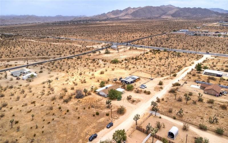 Arial view of home featuring main highway and mountains.