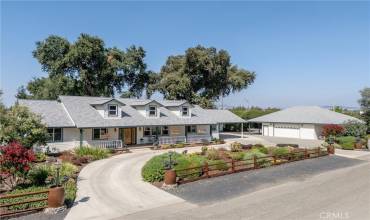 Beautifully landscaped entry with circular drive