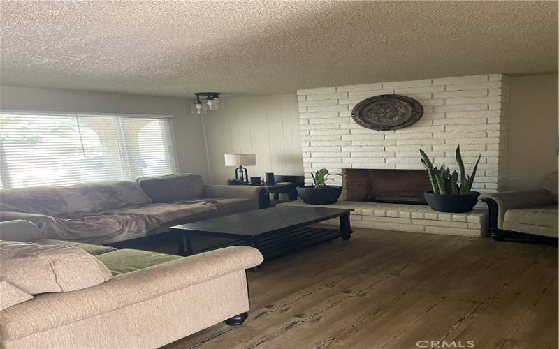 Unit B Livingroom with gas log fireplace