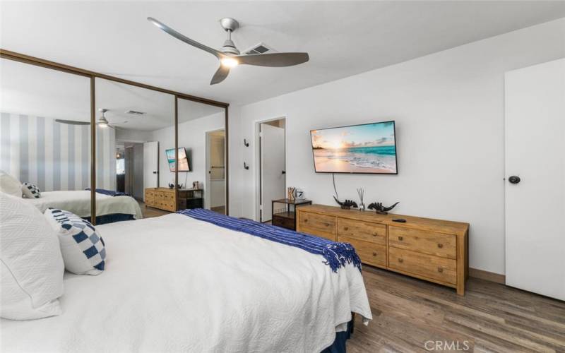 The master bedroom offers a large closet with mirrored sliding doors.