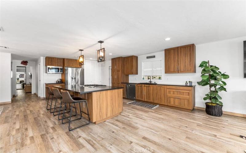 Timeless simulated walnut kitchen cabinets complimented with brushed nickel hardware. All cabined doors and pullout drawers are soft closing.