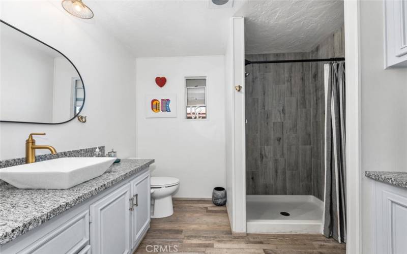 Hallway bath shower remodeled with Porcelain tile.