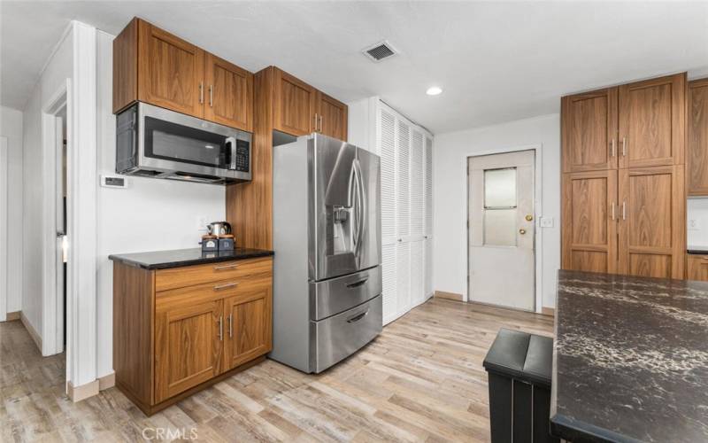 All stainless-steel appliances work really well with the wood flooring and cabinetry.