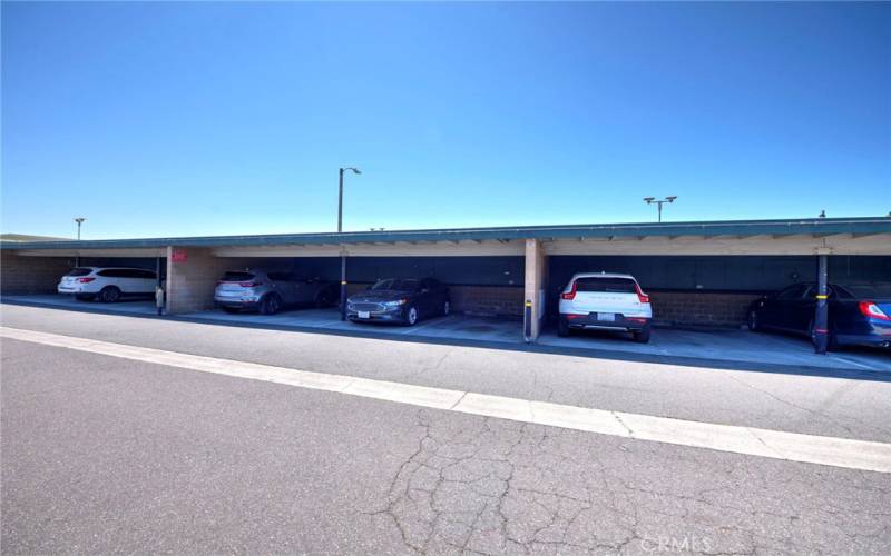 Covered carport #44 gives owner an off-street parking space