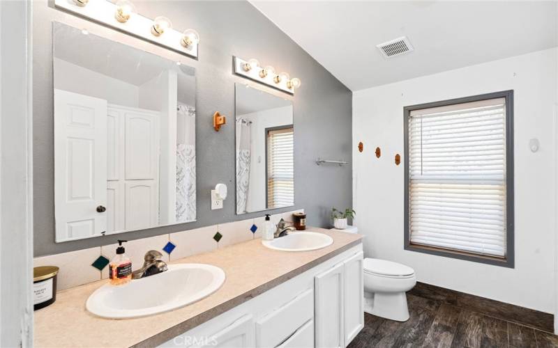 Dual sinks in the guest bath make getting ready a breeze.