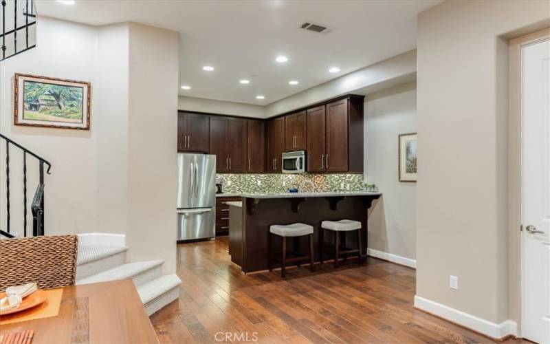 View of Kitchen, Wood Floors and Center Island Eating Area