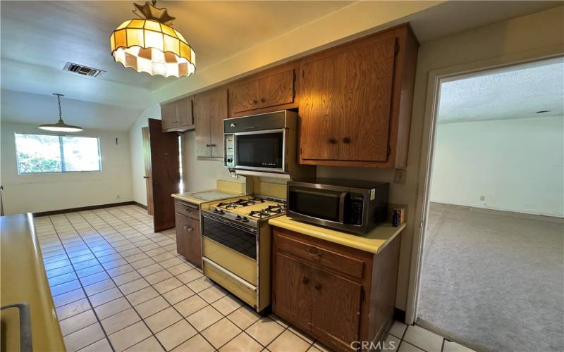 LARGE GALLEY KITCHEN WITH TWO ACCESS POINTS TO THE LIVING ROOM