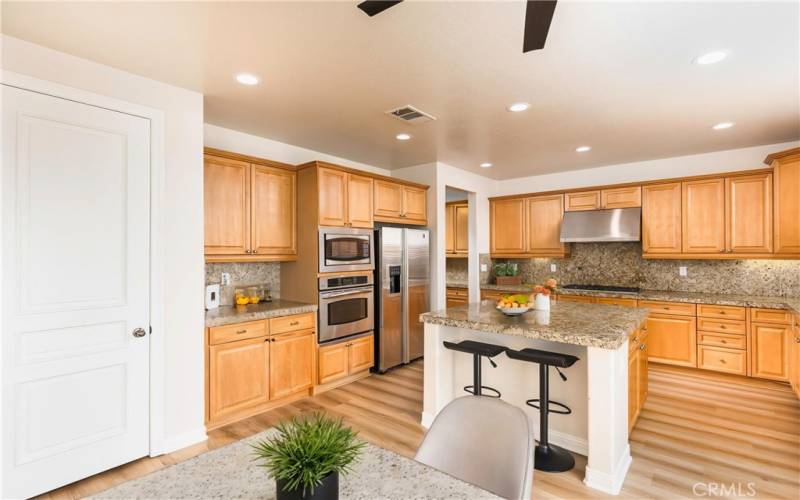 Kitchen view from Family Room - this image has been virtually staged