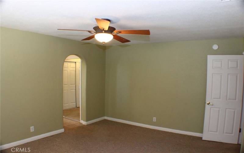 Arched door to Primary Bathroom