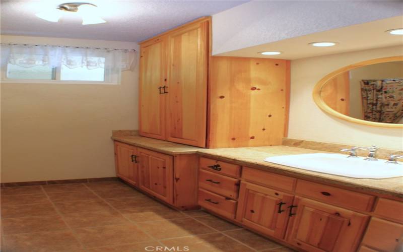 Hickory (or Knotty Pine?) Cabinets in Hall Bathroom