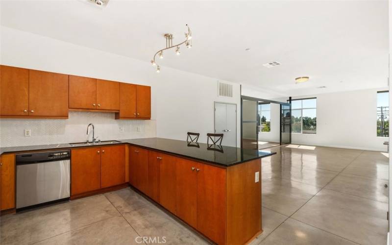 Alternate angle of kitchen looking towards dining room area