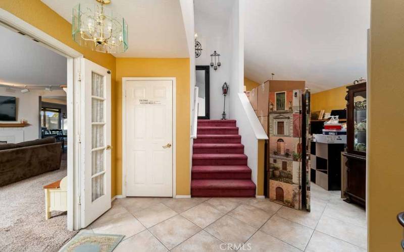 Foyer with family room to the left, living room to the right