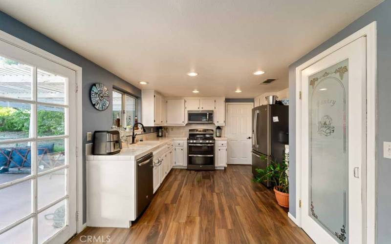 Kitchen with door to formal dining (next to stove)and patio