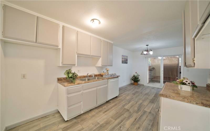 Kitchen, Dinning and to the slice glass door to the Patio