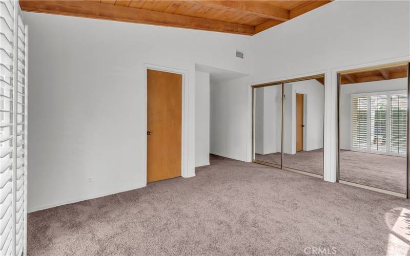 Masterbedroom with mirrored closets.