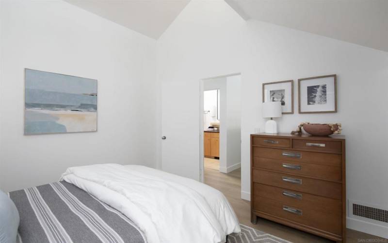 Second bedroom upstairs with queen bed.