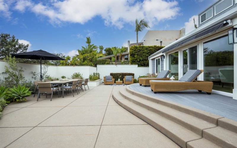 Private Front courtyard with dining table and lounge chairs