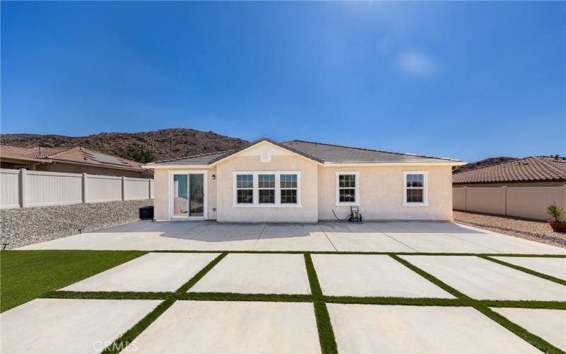 Custom hardscaping with artificial grass.