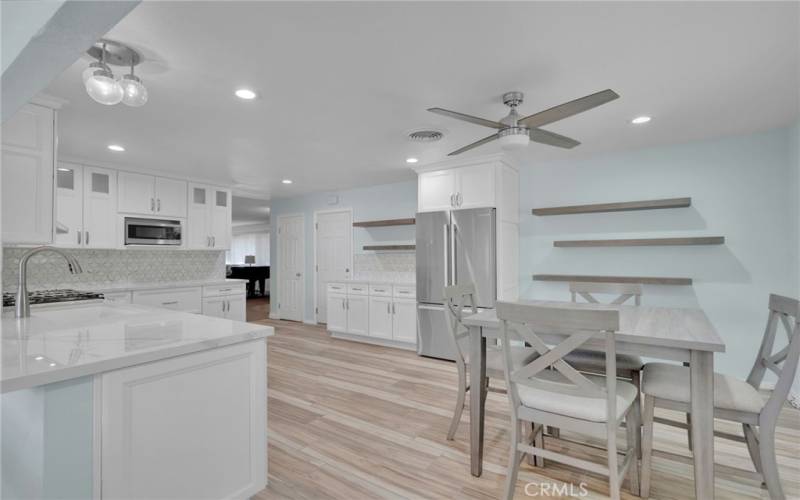 Dining area & door on the right leads to the attached 2 car garage with laundry hook-ups