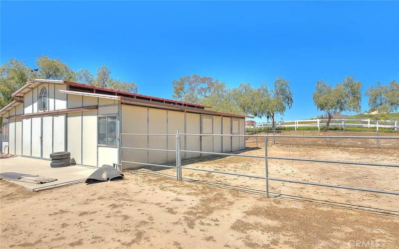 4 stall barn with tack room and turnout area.