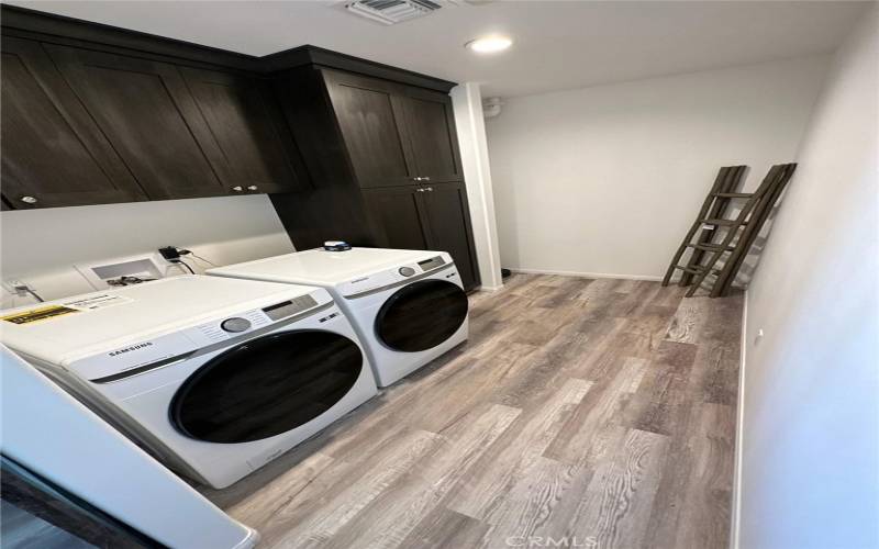 Laundry room with new Samsung washer and dryer