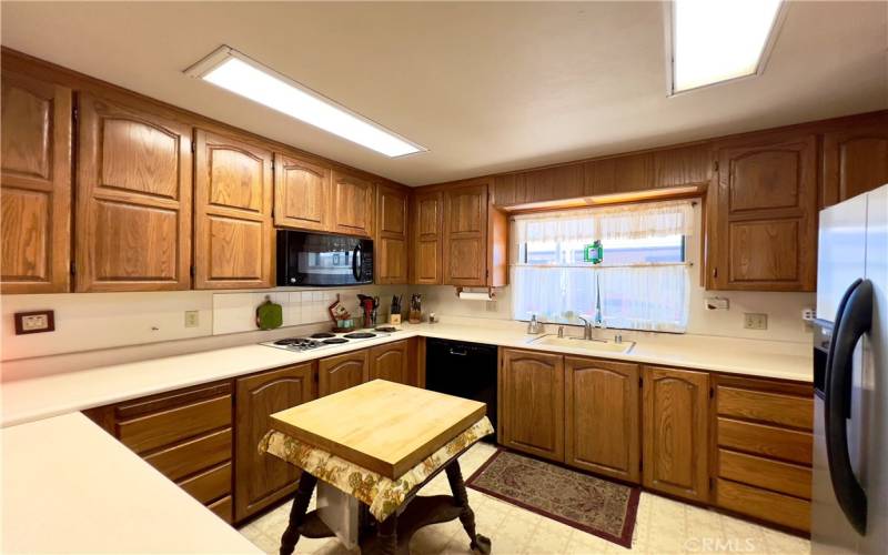 Kitchen with Electric Cooktop stove and Microwave oven