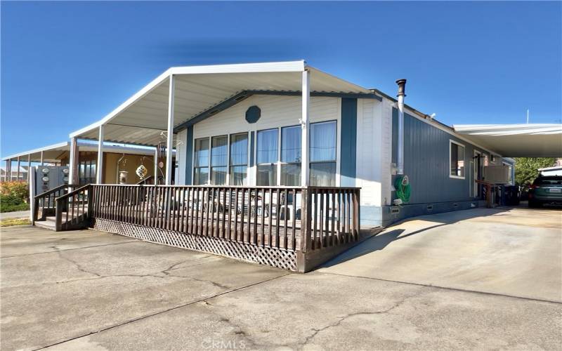 Front with driveway to car port