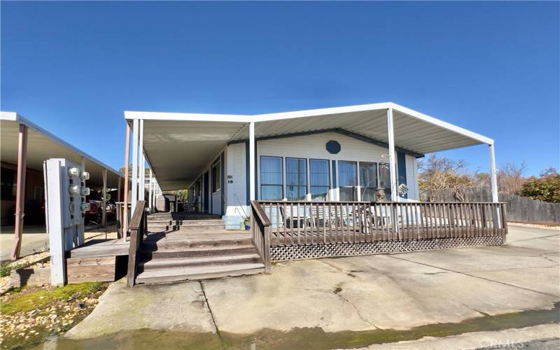 Front with awning over front deck