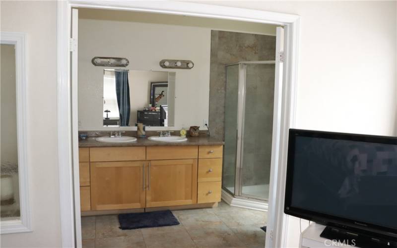 Primary's bathroom, separate shower and tub.  Shower on right side of double sink