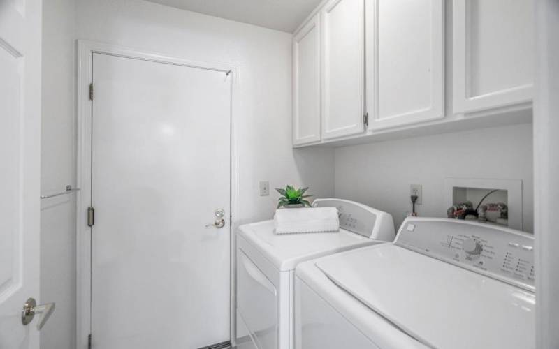 Laundry area with extra cabinet storage