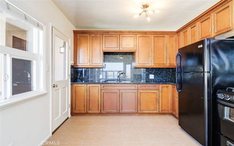 Kitchen with door to bonus room