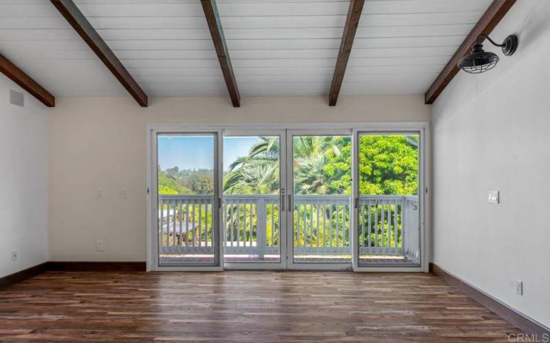 Primary bedroom with deck and beautiful views