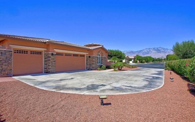 Driveway with garages and view