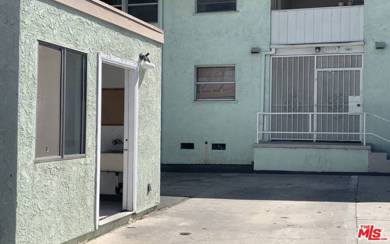 Laundry room right at rear door