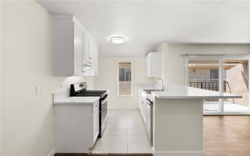 Newly renovated kitchen with quartz counters.