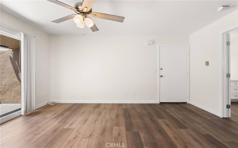 Living room with new flooring throughout the entire home.