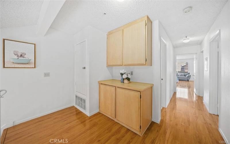 upstairs hallway with storage cabinets