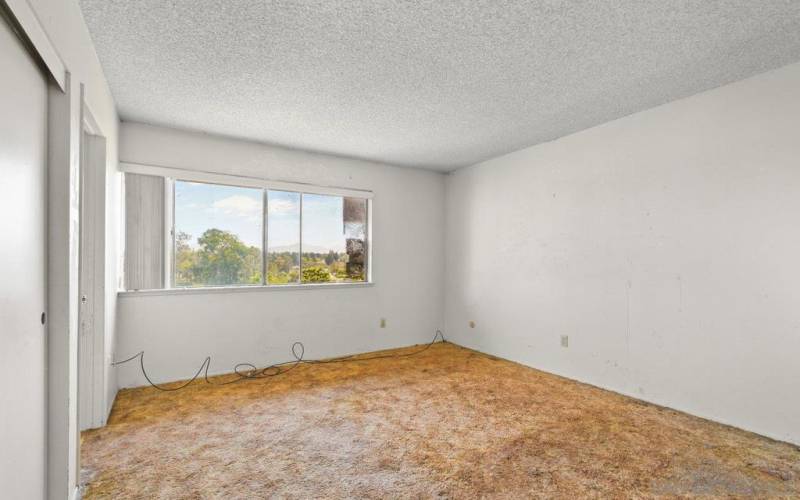 Primary bedroom with mountain/hill views