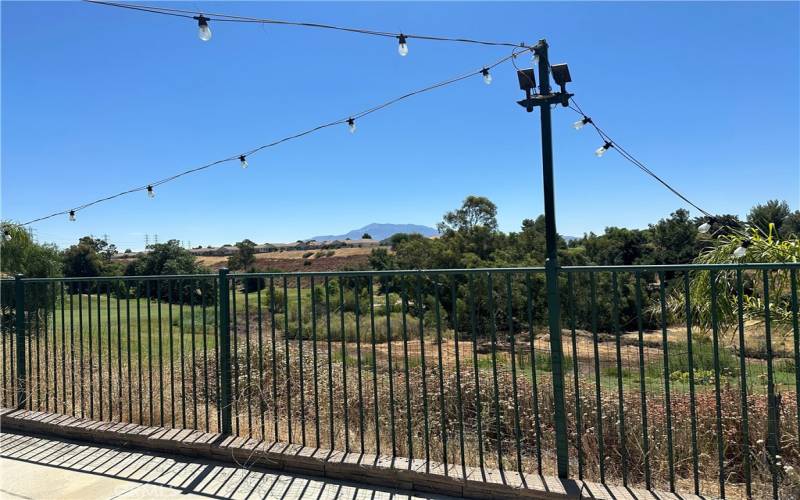 Beautiful views from the large backyard. You can see the local mountains in the distance and the green golf course below.