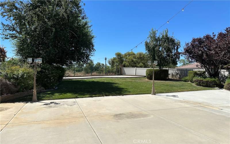 The backyard has been updated as well with a large cement patio, overhead lighting, and cemented area near the back fence for enjoying the beautiful views.