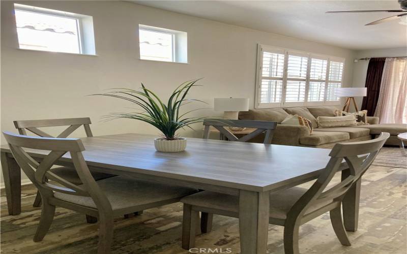 The kitchen has a bar area for dining and there is space off of the kitchen for a dining table as well.