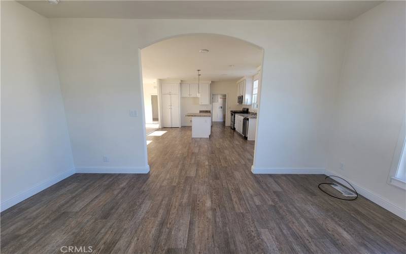 Enter the open plan office (or formal dining room or family room!) through the archway from the kitchen that could even be closed off to make a third bedroom.