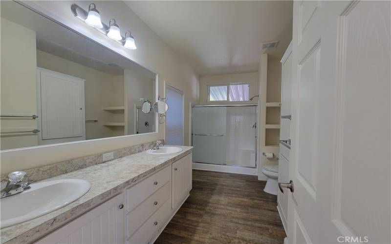 The master bath features two sinks, large walk in shower with his 'n her seats and large linens closet.