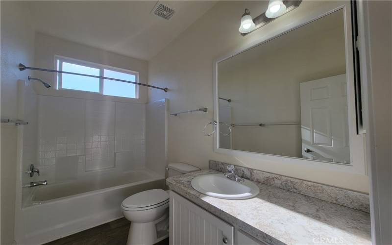 Natural light over the guest bath adds to the ambience.