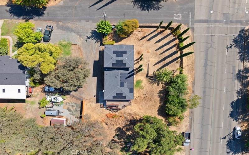 Top view of property.  Large area to the right of the house and the back of the house.  Neighbor to the right.  Shared driveway with neighbor.