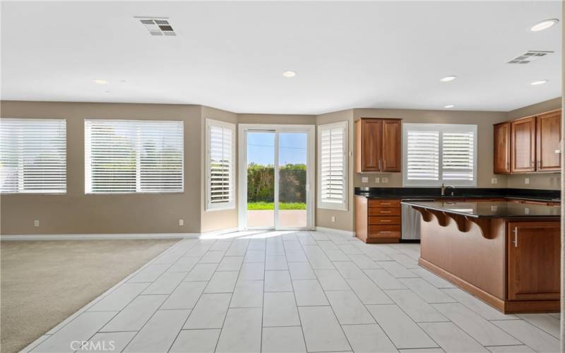 Open floor plan to kitchen and main room with Slider to go outside